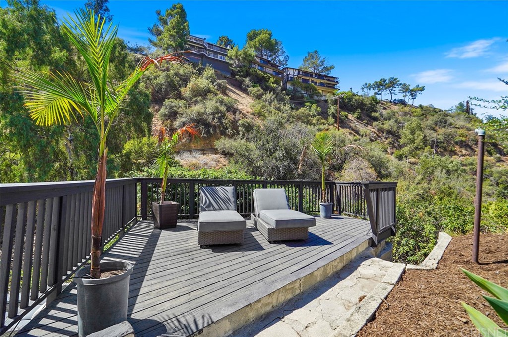 431 Nesmuth Road Glendale, CA 91202 - Photo 35 of 68 a view of a deck with couches with wooden floor and fence