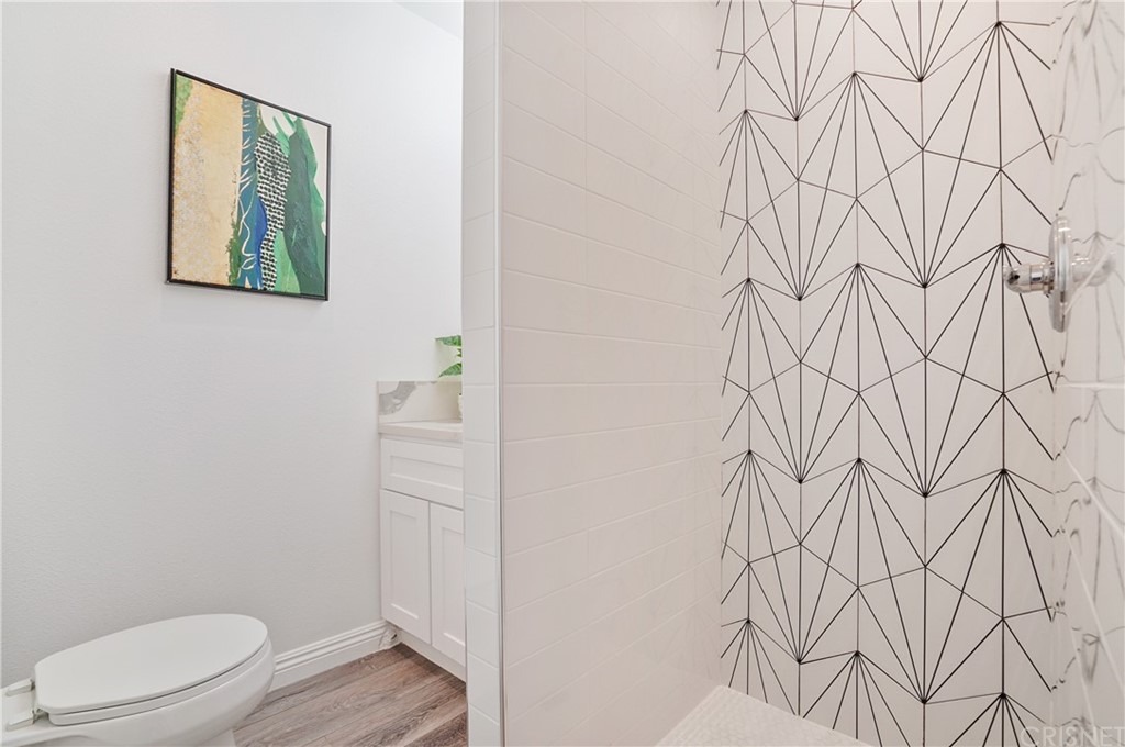 431 Nesmuth Road Glendale, CA 91202 - Photo 50 of 68 a bathroom with a toilet and a window