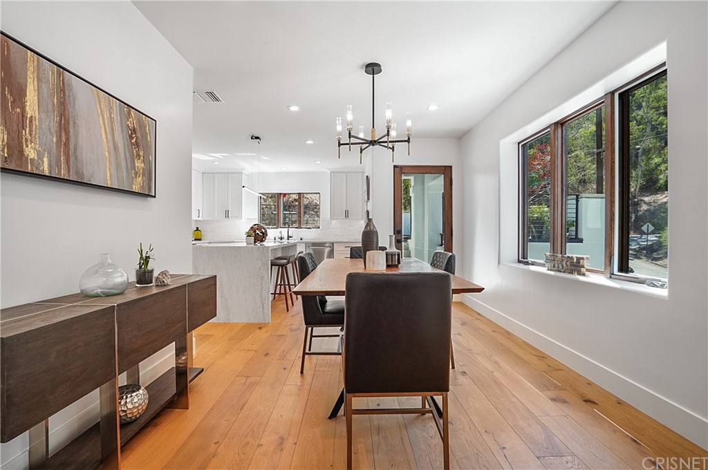 431 Nesmuth Road Glendale, CA 91202 - Photo 5 of 68 a dining room with wooden floor and windows