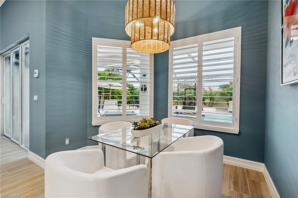 8239 Potomac Lane Naples, FL 34104 - Photo 20 of 47 a bath tub sitting next to a window