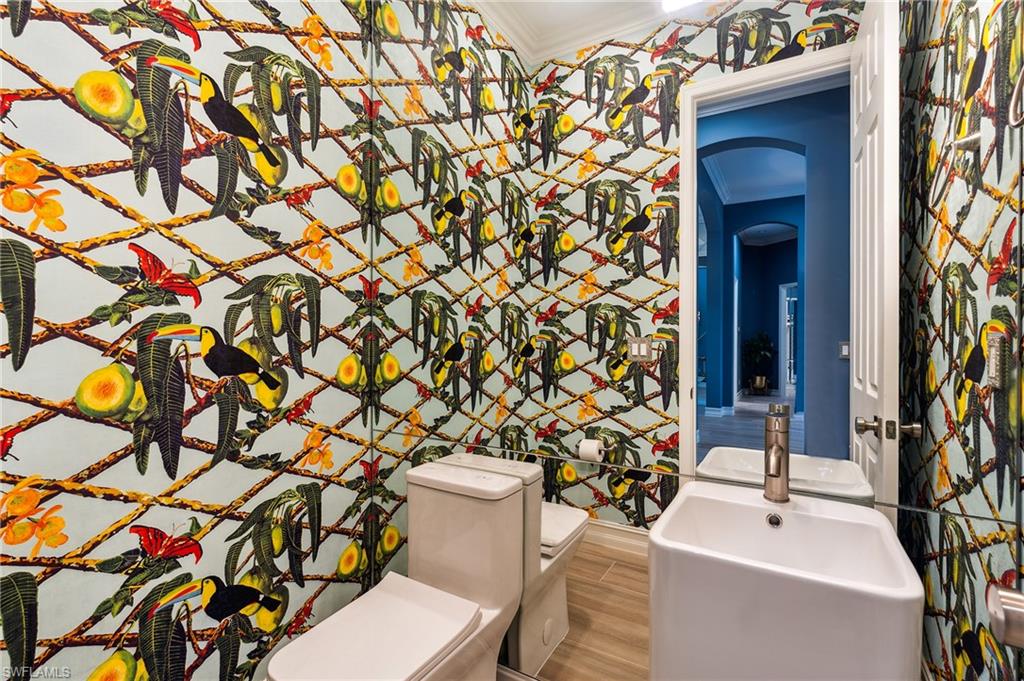 8239 Potomac Lane Naples, FL 34104 - Photo 40 of 47 a bathroom with a sink toilet and shower