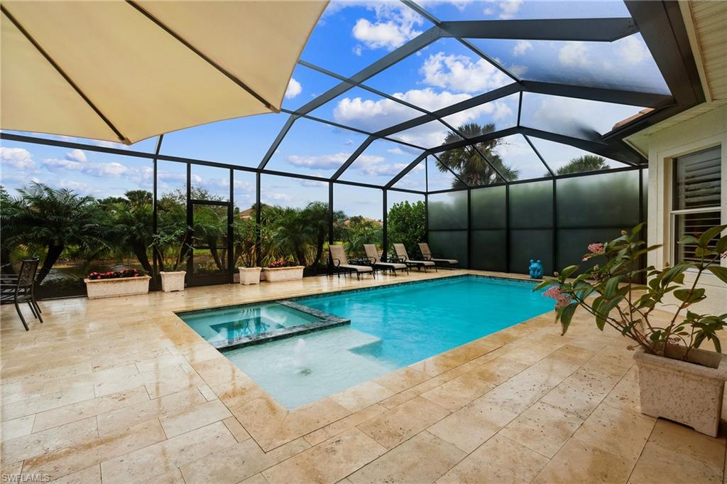 8239 Potomac Lane Naples, FL 34104 - Photo 45 of 47 a view of a swimming pool with a patio