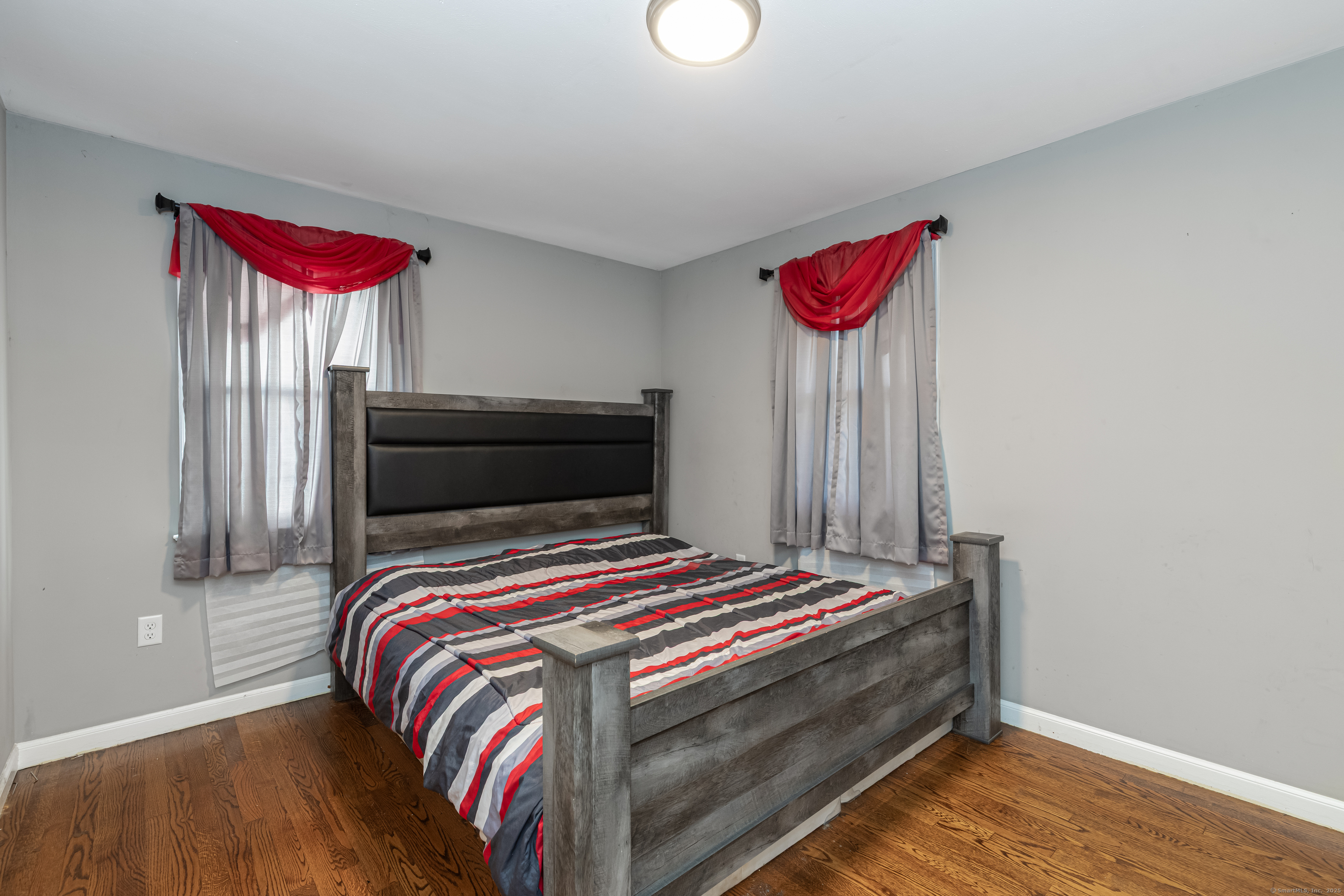 148 Central Avenue West Haven, CT 06516 - Photo 11 of 26 a bedroom with a bed and a window