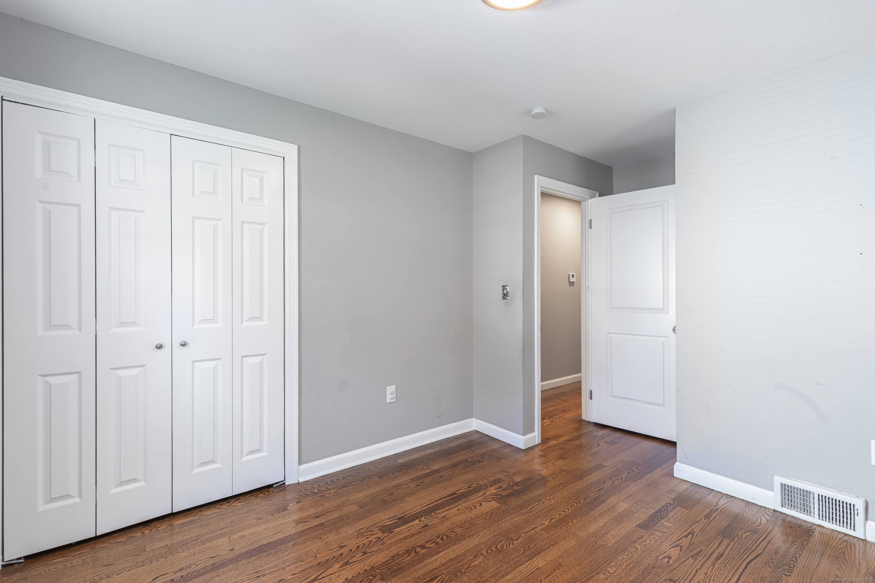 148 Central Avenue West Haven, CT 06516 - Photo 16 of 26 a view of an empty room with wooden floor