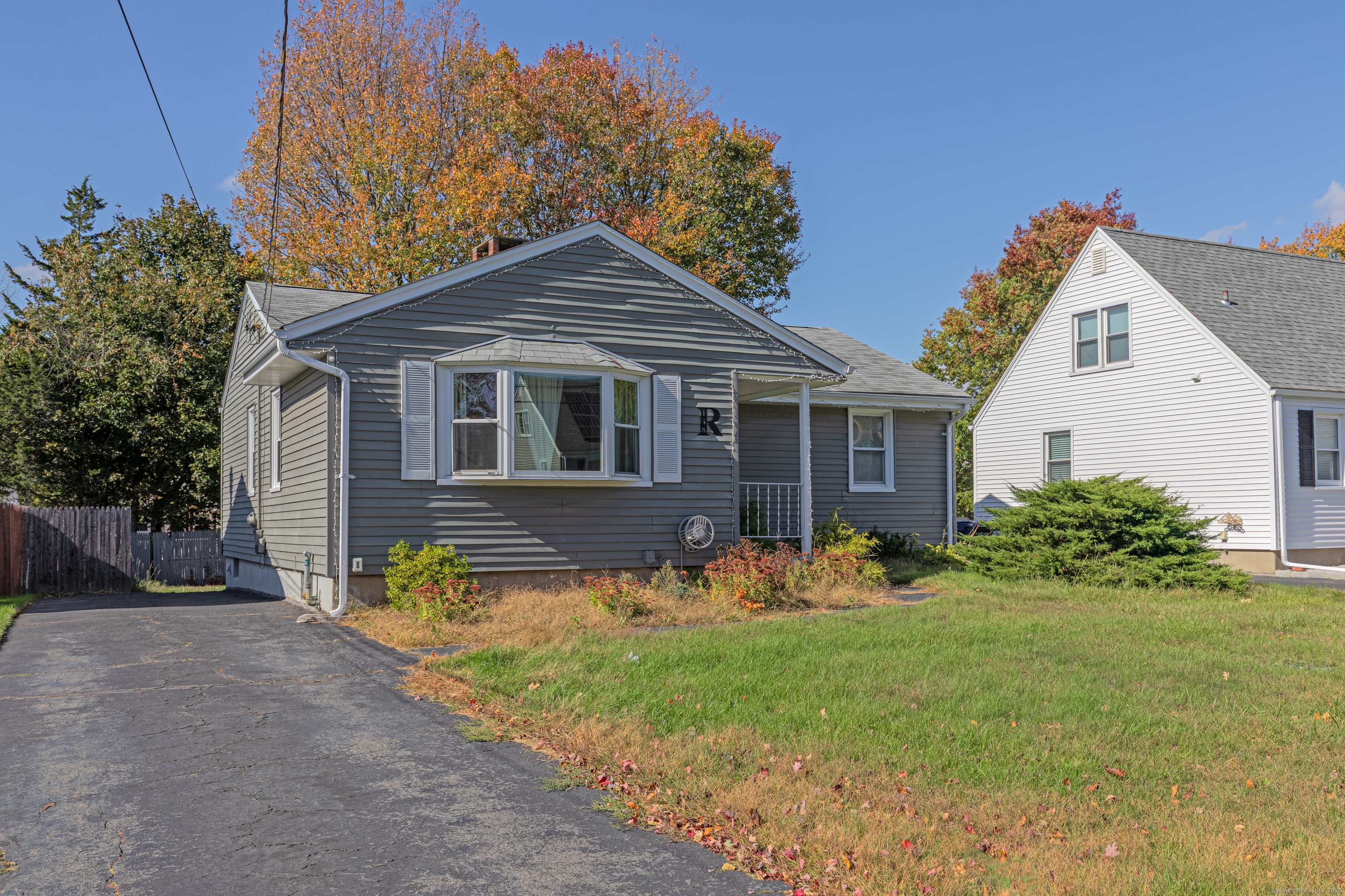 148 Central Avenue West Haven, CT 06516 - Photo 2 of 26 a front view of house with yard and trees in the background