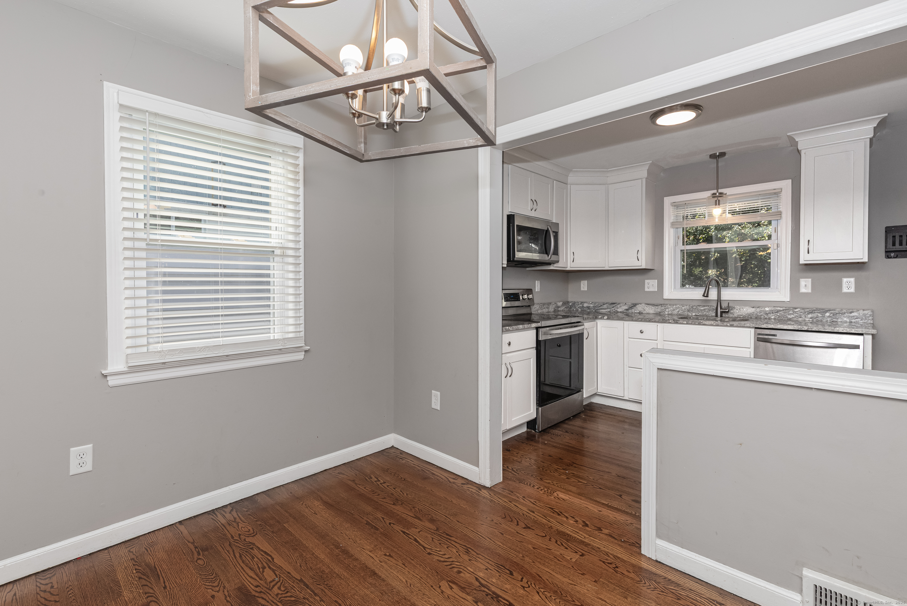 148 Central Avenue West Haven, CT 06516 - Photo 6 of 26 a kitchen with granite countertop white cabinets and appliances