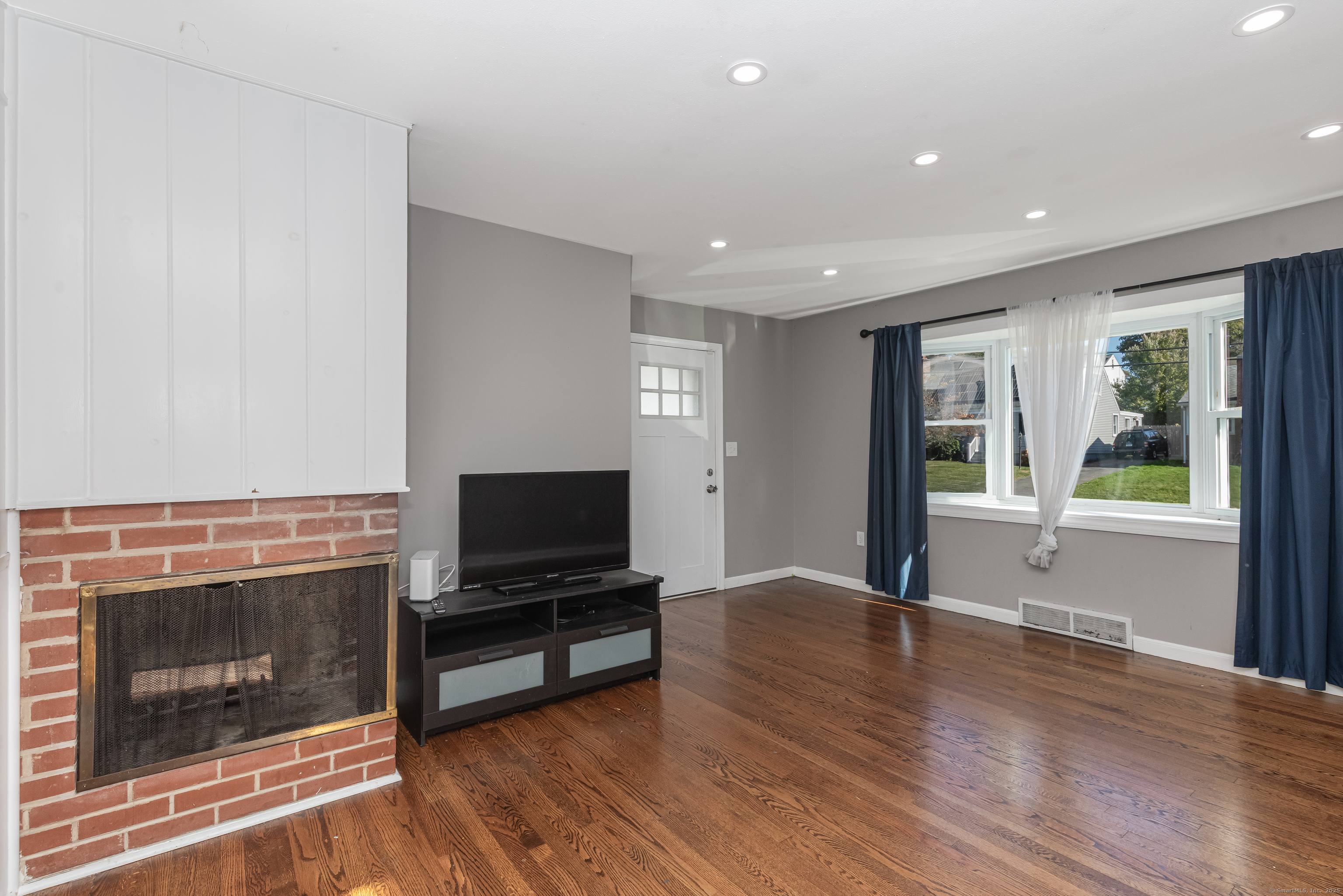 148 Central Avenue West Haven, CT 06516 - Photo 8 of 26 a living room with furniture fireplace and flat screen tv