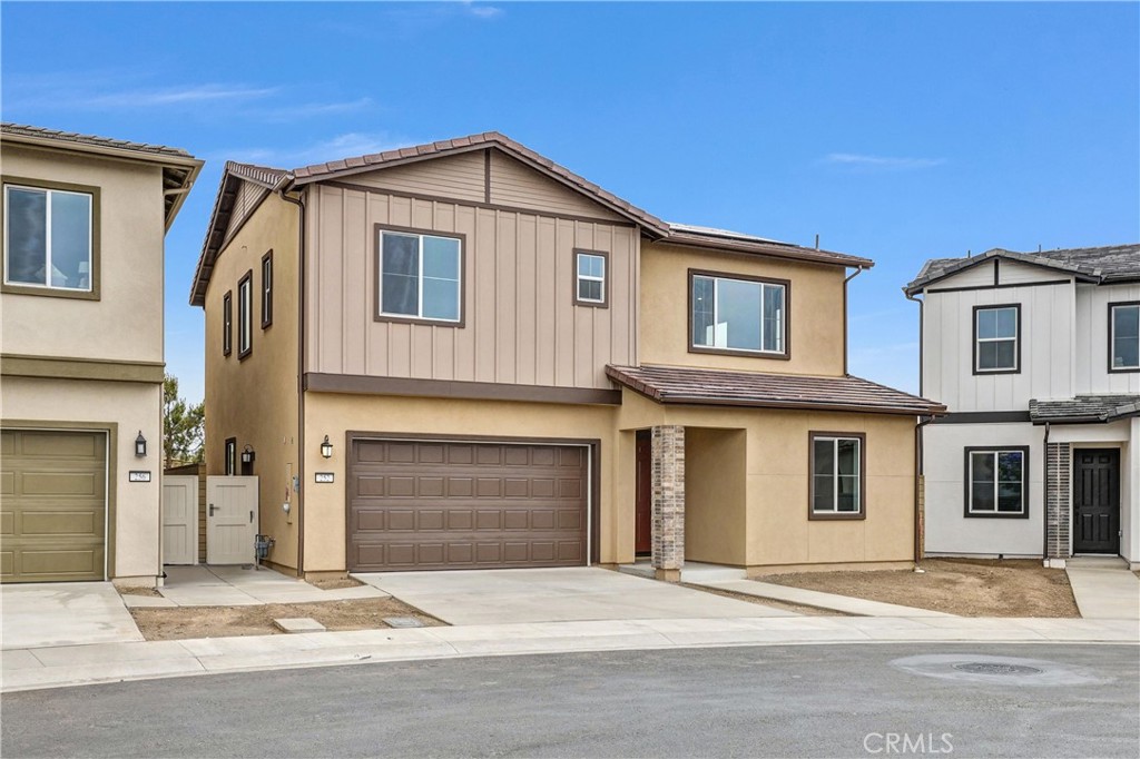 252 Lily Loop Irvine, CA 92618 - Photo 2 of 6 a front view of a house with a yard