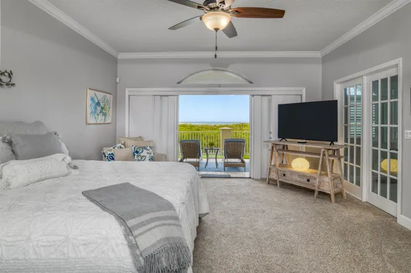 a view of a porch with furniture and garden
