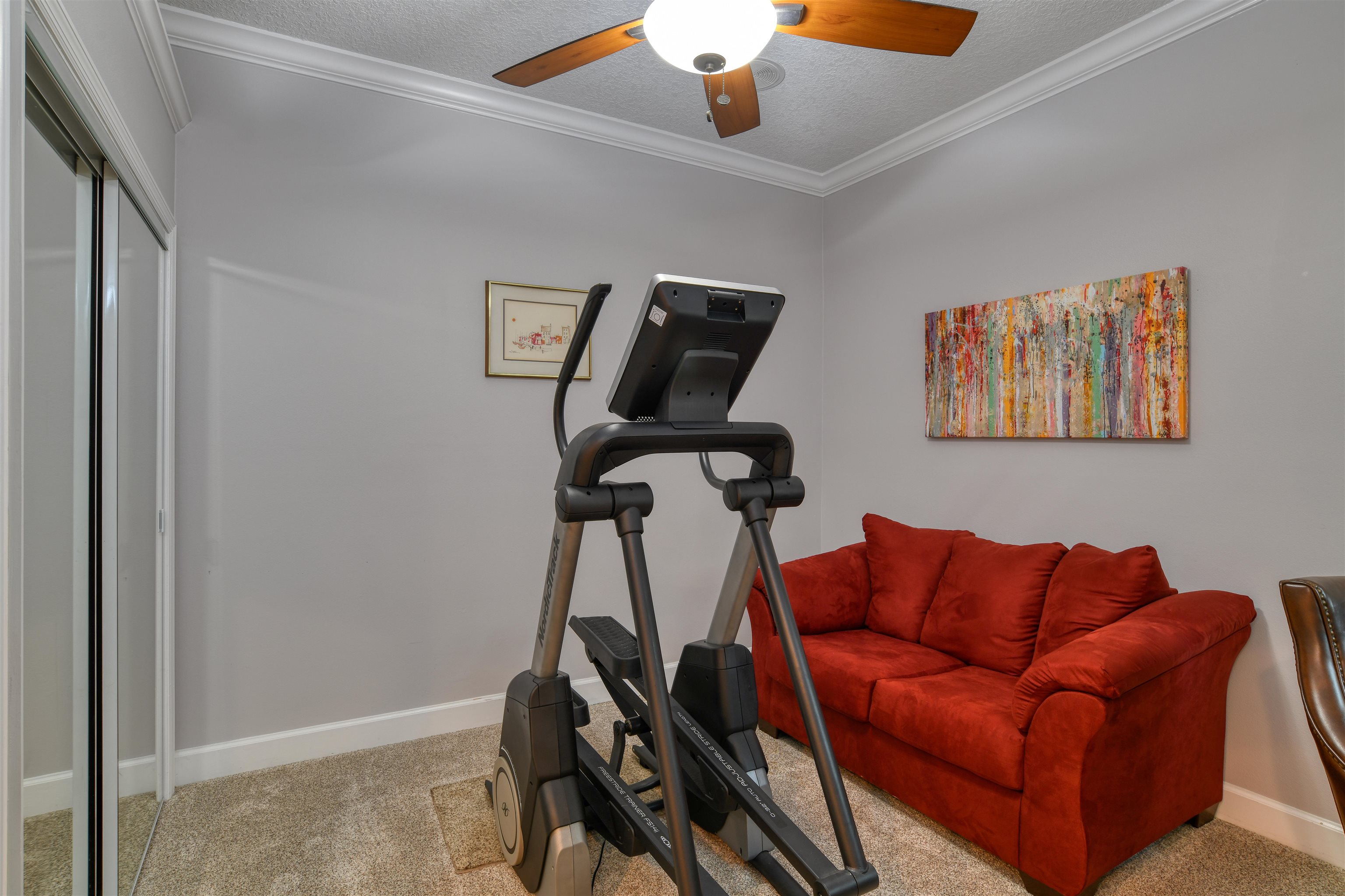 616 Mediterranean Way St. Augustine, FL 32080 - Photo 25 of 64 a blue couch sitting next to a window