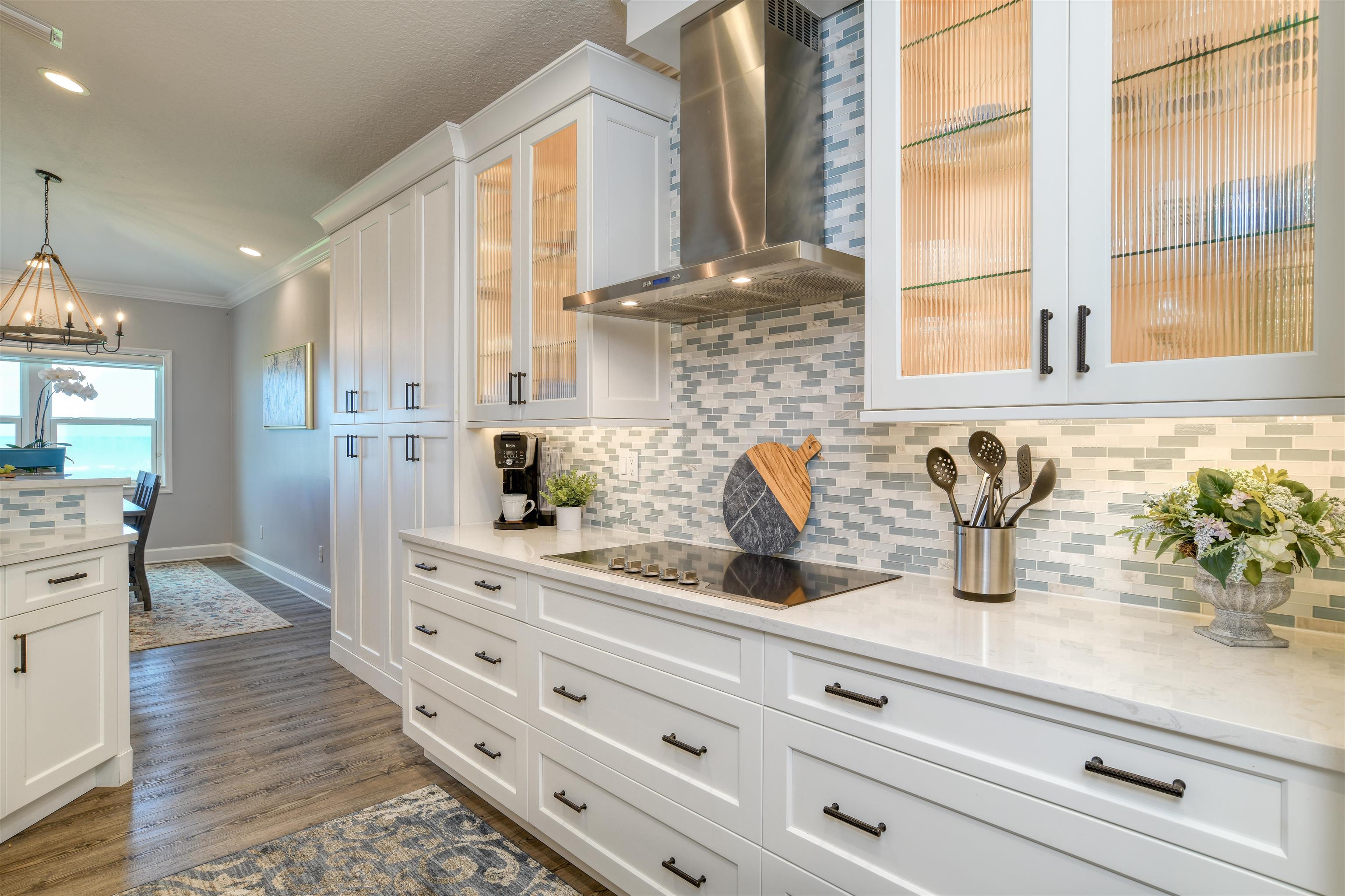 616 Mediterranean Way St. Augustine, FL 32080 - Photo 44 of 64 a kitchen with stainless steel appliances white cabinets and a window