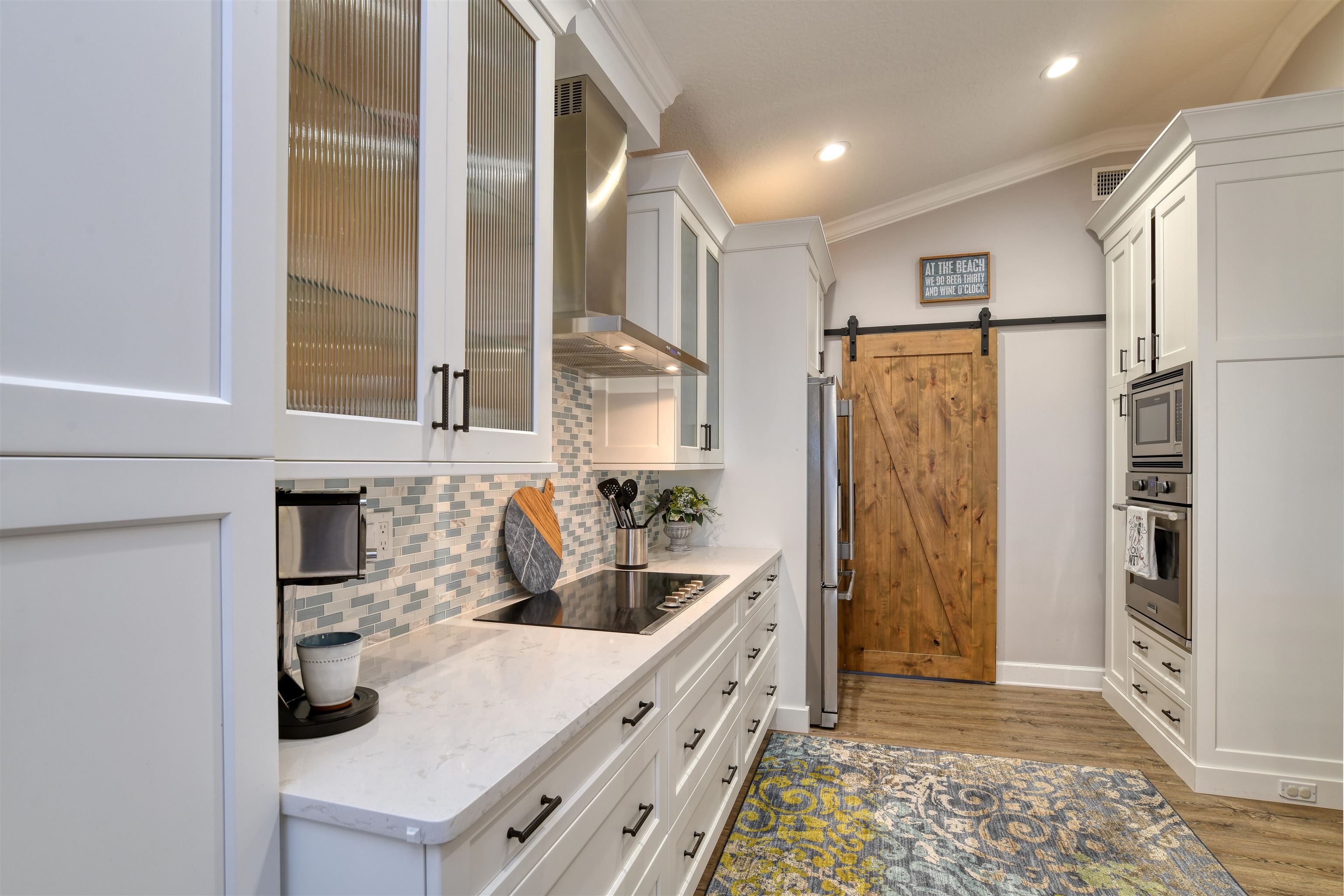 616 Mediterranean Way St. Augustine, FL 32080 - Photo 46 of 64 a kitchen with stainless steel appliances granite countertop a refrigerator and a sink