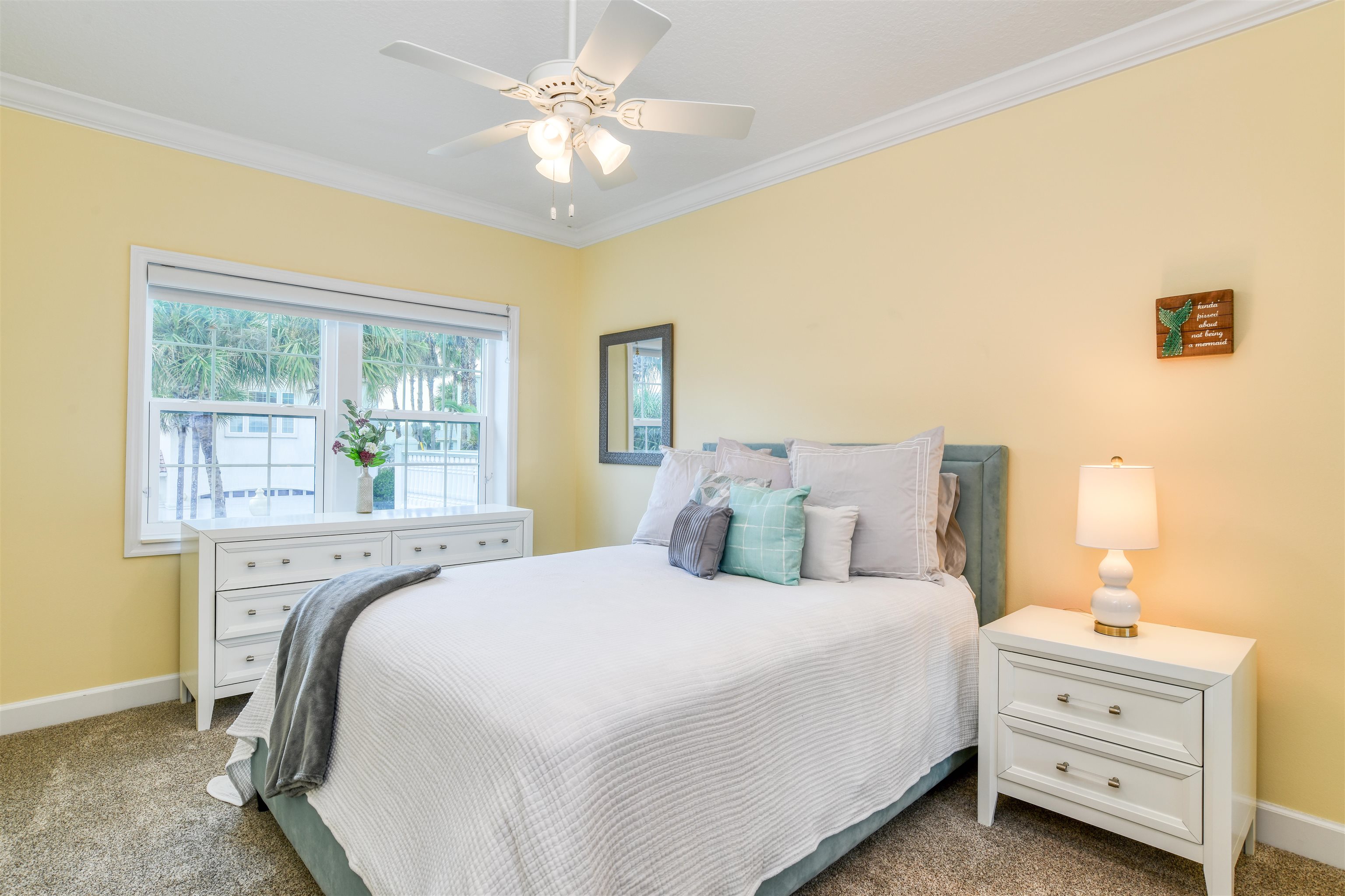 616 Mediterranean Way St. Augustine, FL 32080 - Photo 50 of 64 a bedroom with a bed and a chandelier