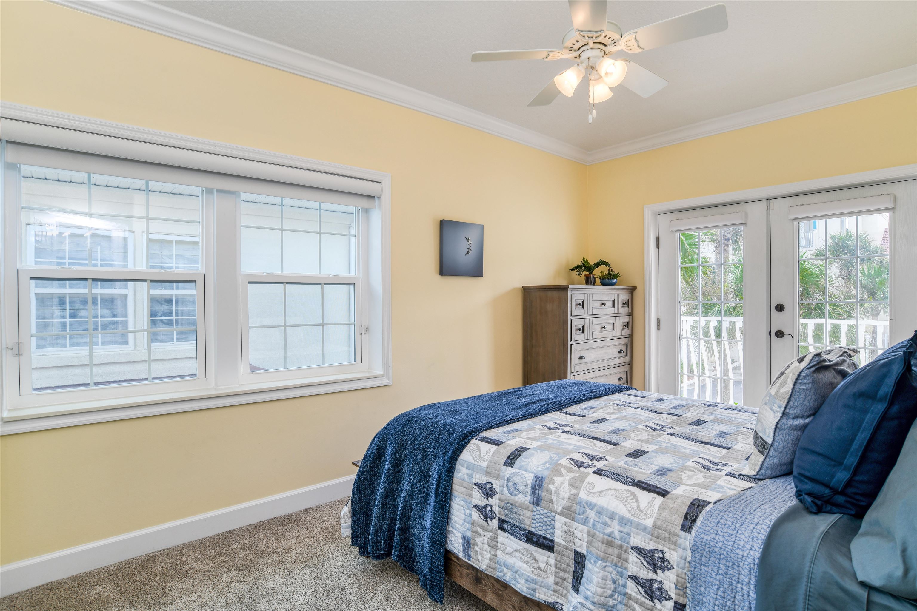 616 Mediterranean Way St. Augustine, FL 32080 - Photo 53 of 64 a bedroom with a bed and glass window