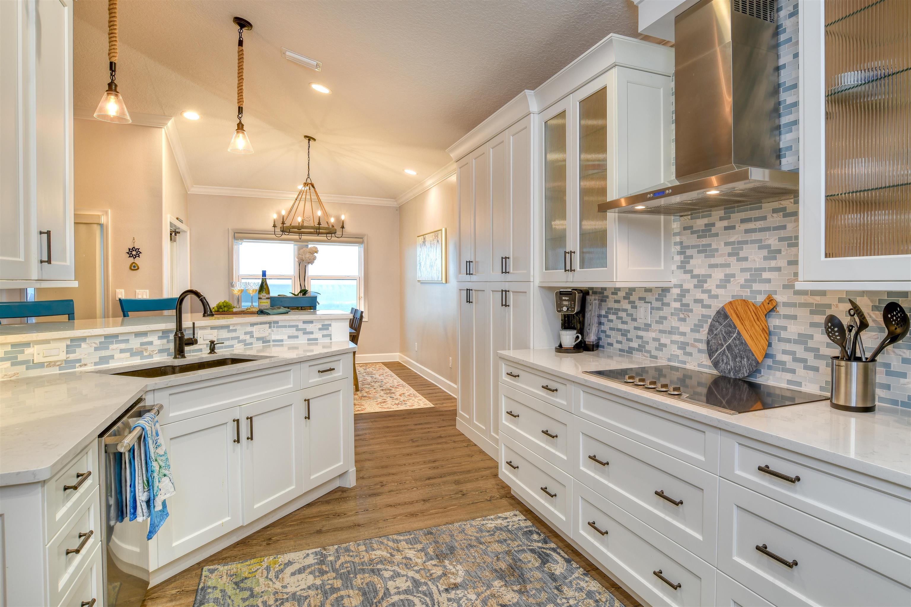 616 Mediterranean Way St. Augustine, FL 32080 - Photo 7 of 64 a large kitchen with granite countertop a sink a stove and cabinets