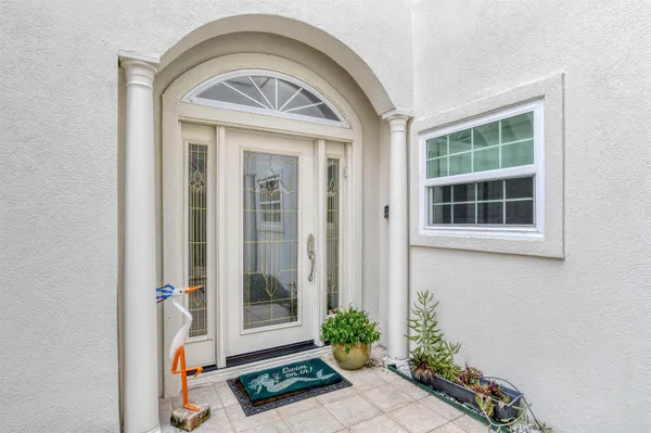 a front view of a house with a flower garden