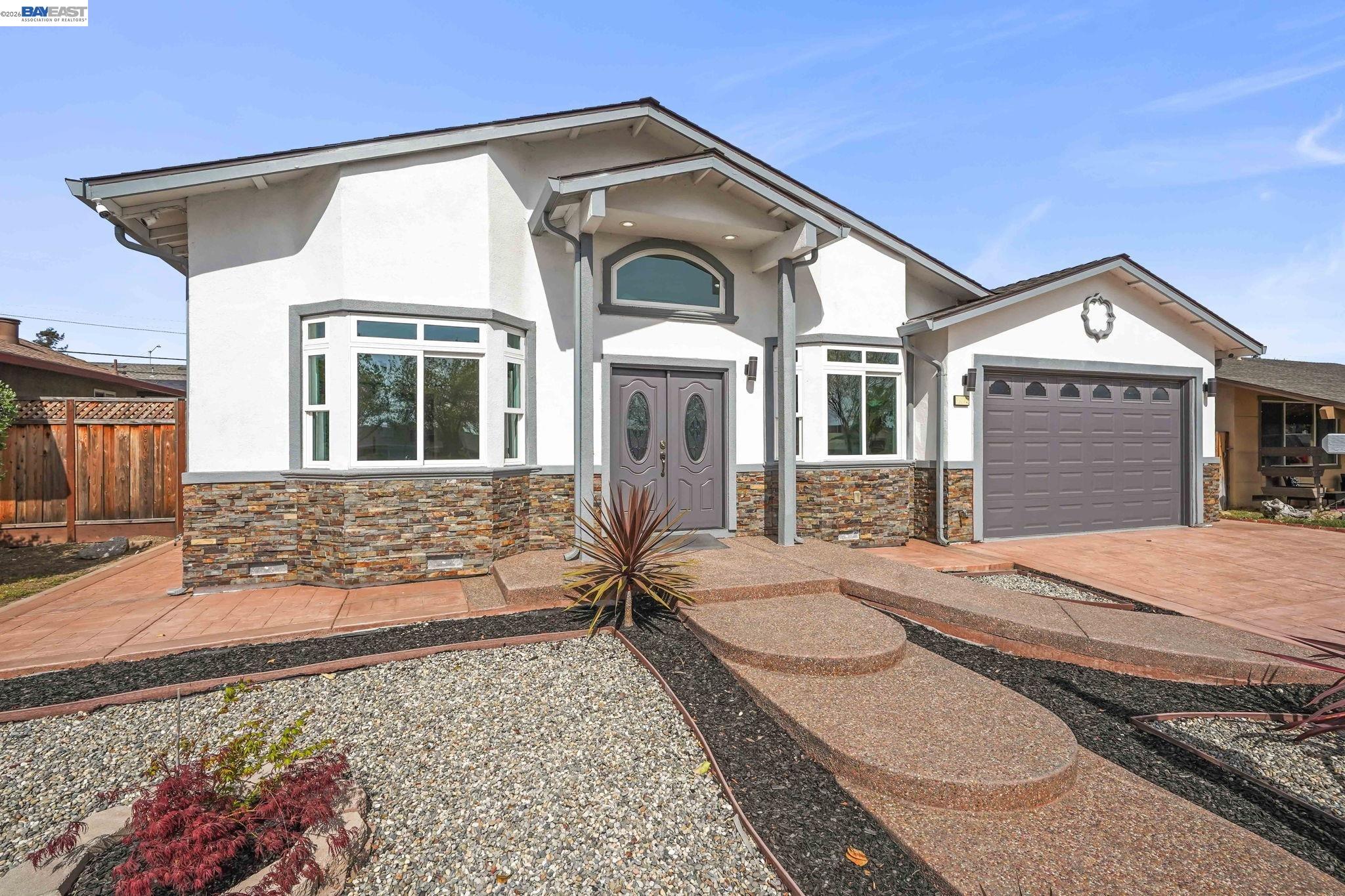 40772 Blacow Road Fremont, CA 94538 - Photo 5 of 40 a front view of a house with a yard