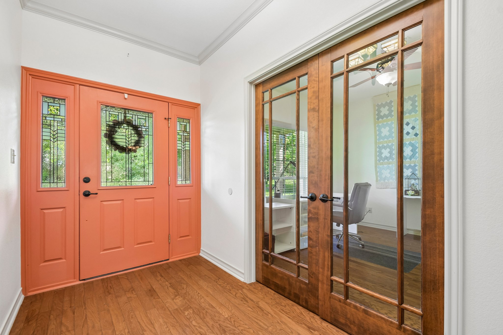 307 West 4th Street Elgin, TX 78621 - Photo 4 of 40 Entryway featuring a coral-hued front door with decorative glass side panels and transom
