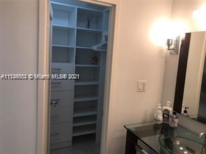100 Lincoln Road, Unit 928 Miami Beach, FL 33139 - Photo 6 of 21 a bathroom with a sink and a mirror
