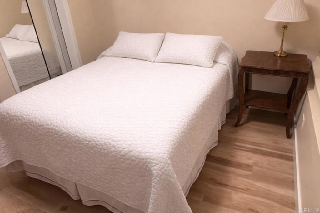 714 Passiflora Avenue, Unit 1 Encinitas, CA 92024 - Photo 4 of 14 a bed sitting in a bedroom next to a window