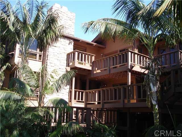 714 Passiflora Avenue, Unit 1 Encinitas, CA 92024 - Photo 10 of 14 a view of a yard with a house and a palm tree