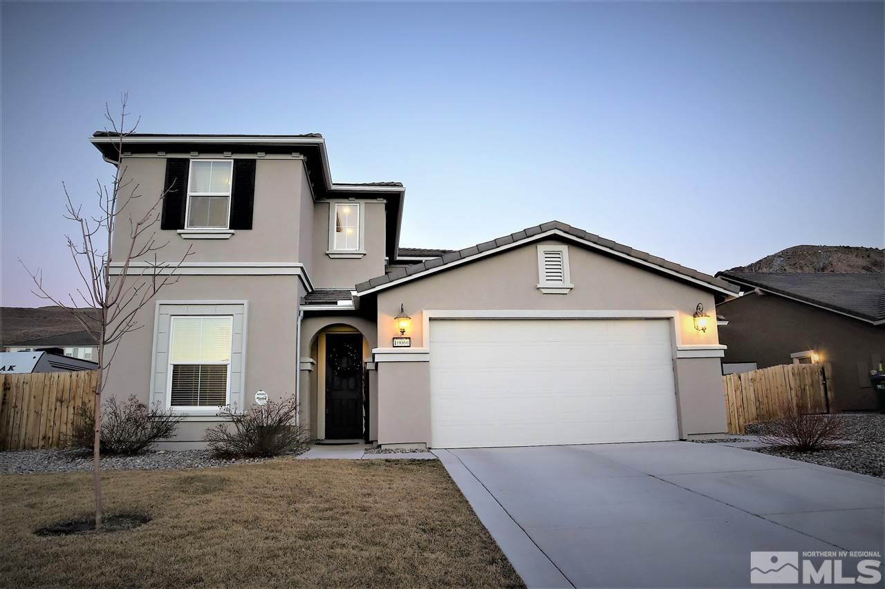 10060 Barrel Racer Drive Reno, NV 89521 - Photo 1 of 13 a front view of a house with a garage