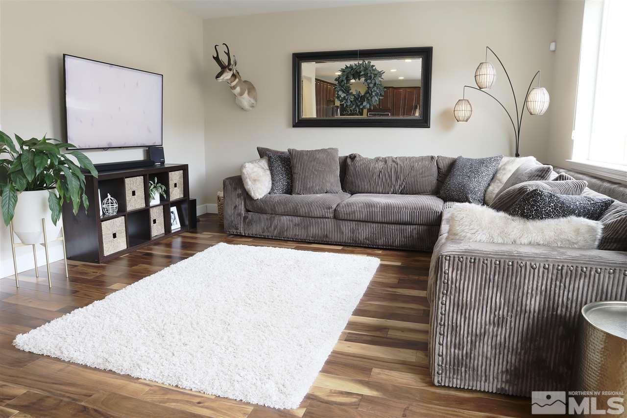 10060 Barrel Racer Drive Reno, NV 89521 - Photo 4 of 13 a living room with furniture and wooden floor