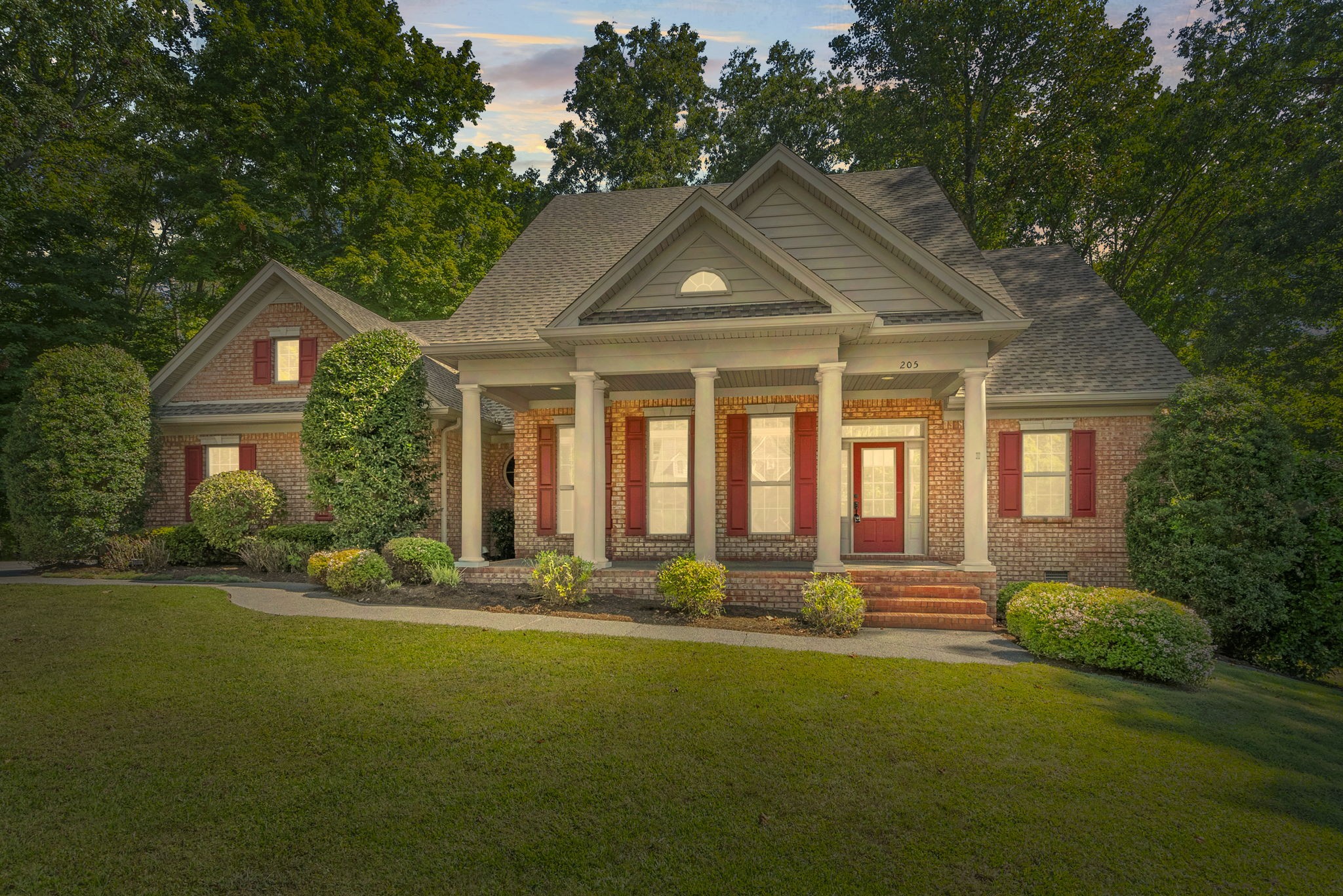 a front view of a house with a yard