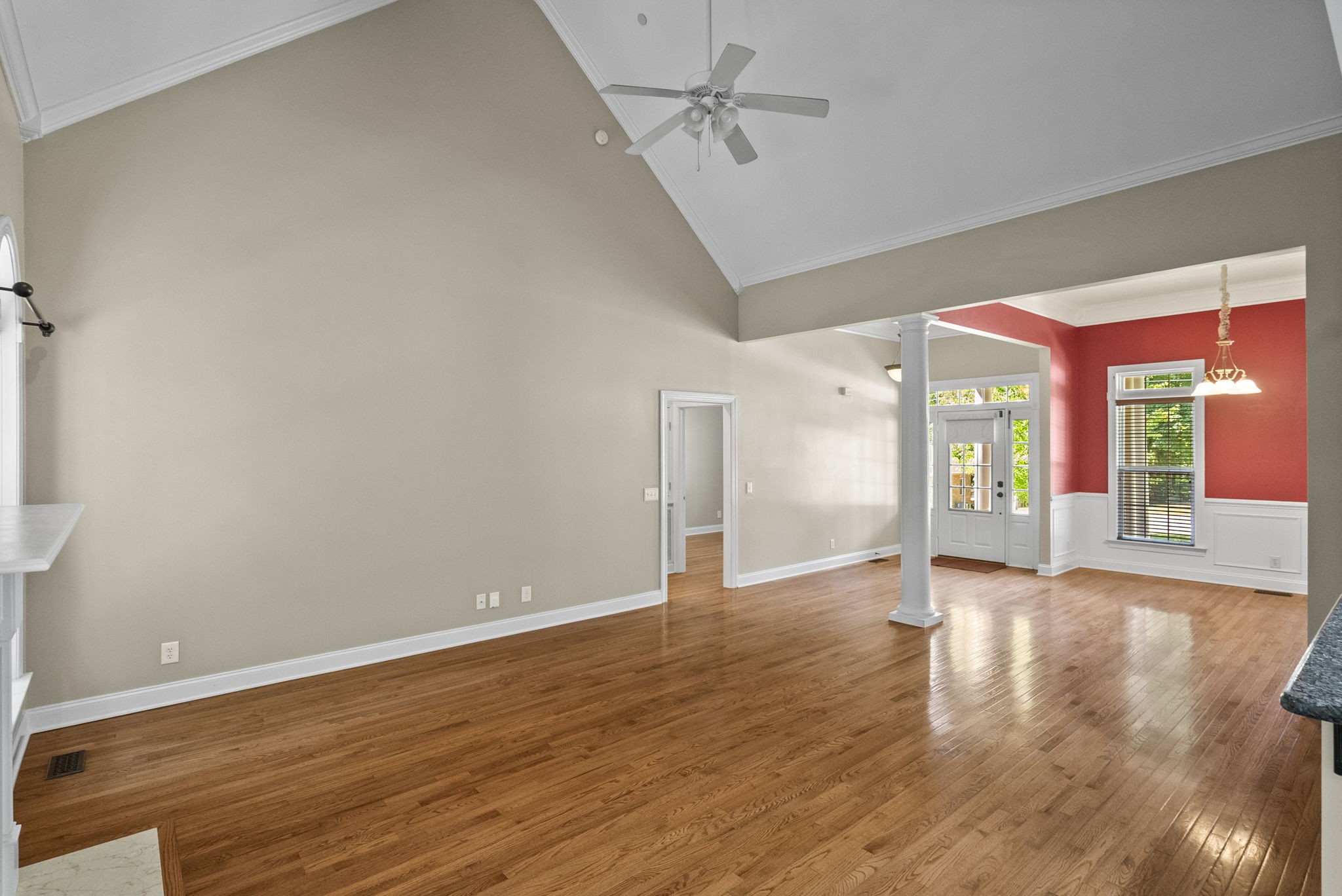 205 Yearling Trace Pleasant View, TN 37146 - Photo 13 of 29 a view of an empty room with wooden floor and a window