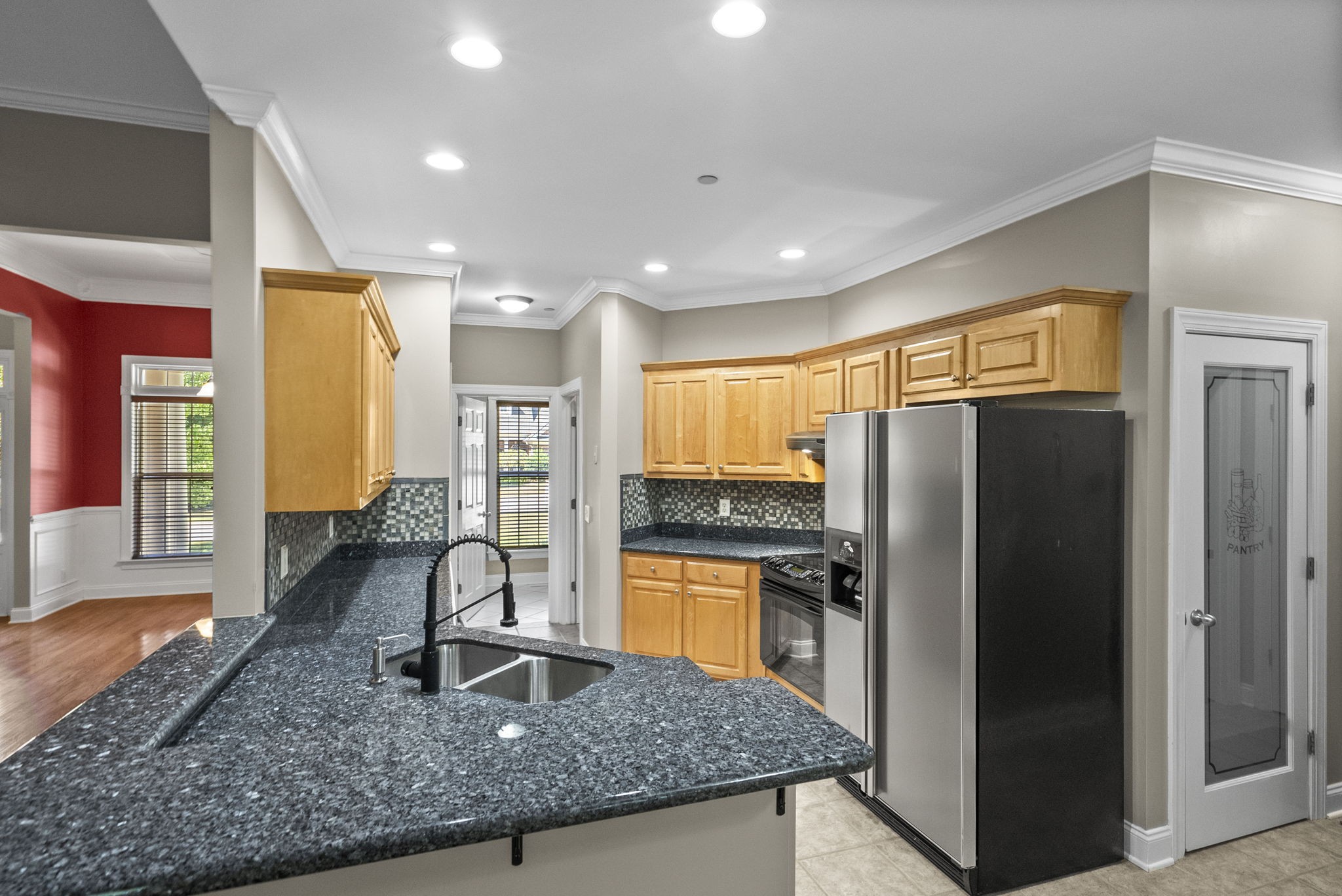 205 Yearling Trace Pleasant View, TN 37146 - Photo 15 of 29 a kitchen with stainless steel appliances granite countertop a refrigerator a stove and a sink