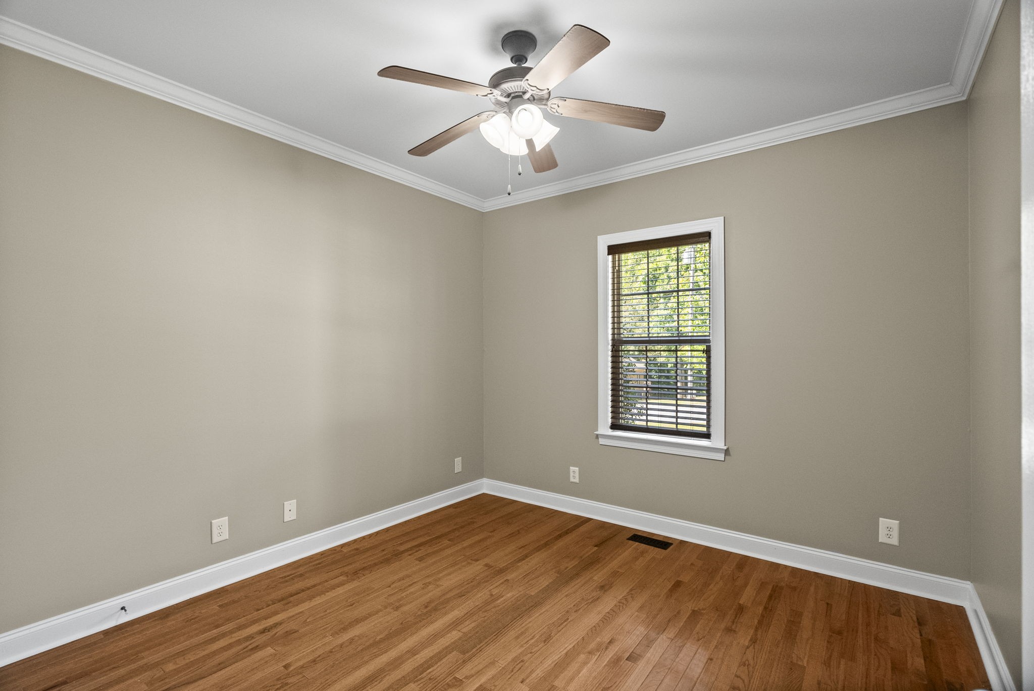 205 Yearling Trace Pleasant View, TN 37146 - Photo 21 of 29 a view of an empty room with window and wooden floor