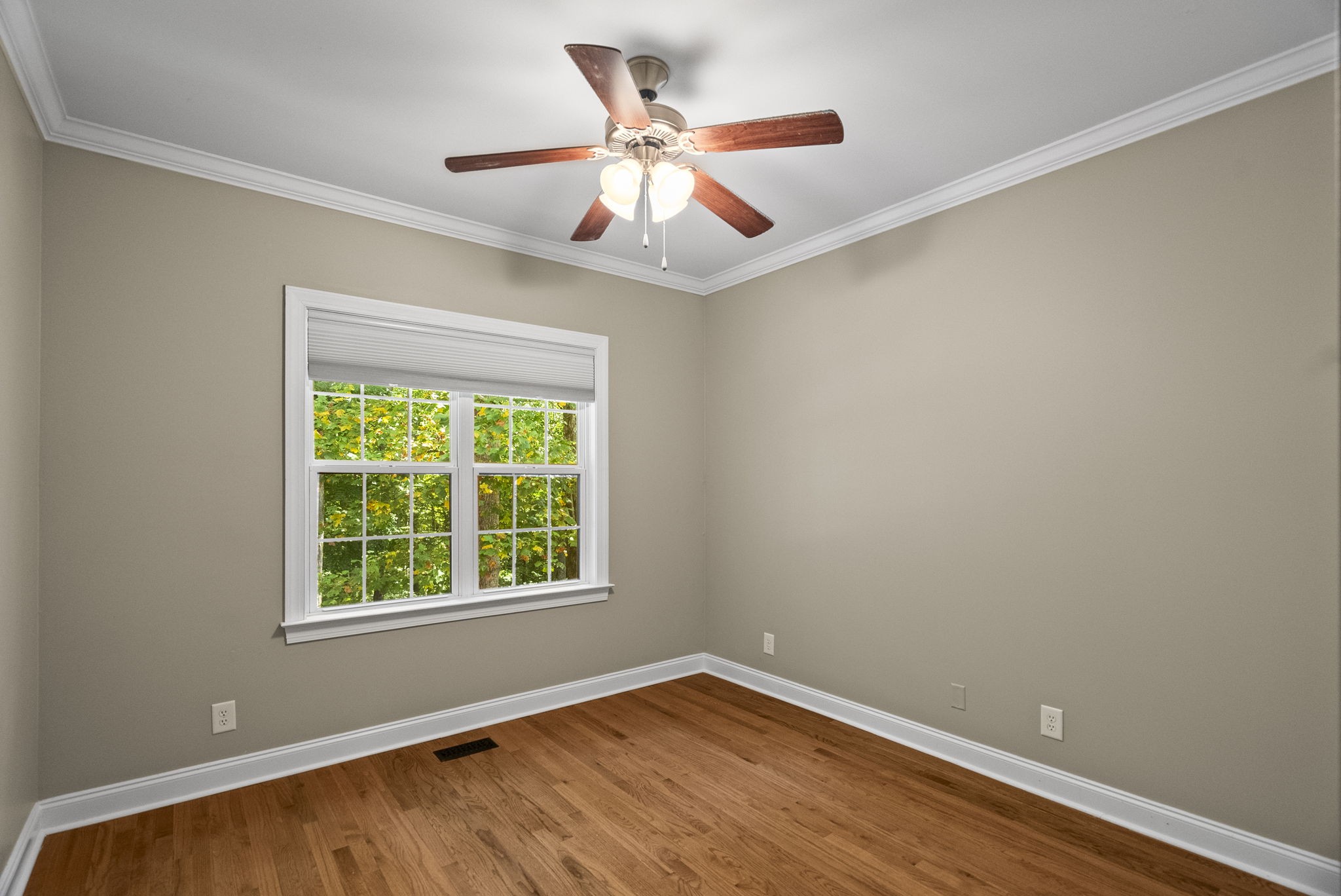 205 Yearling Trace Pleasant View, TN 37146 - Photo 22 of 29 an empty room with a window and a ceiling fan