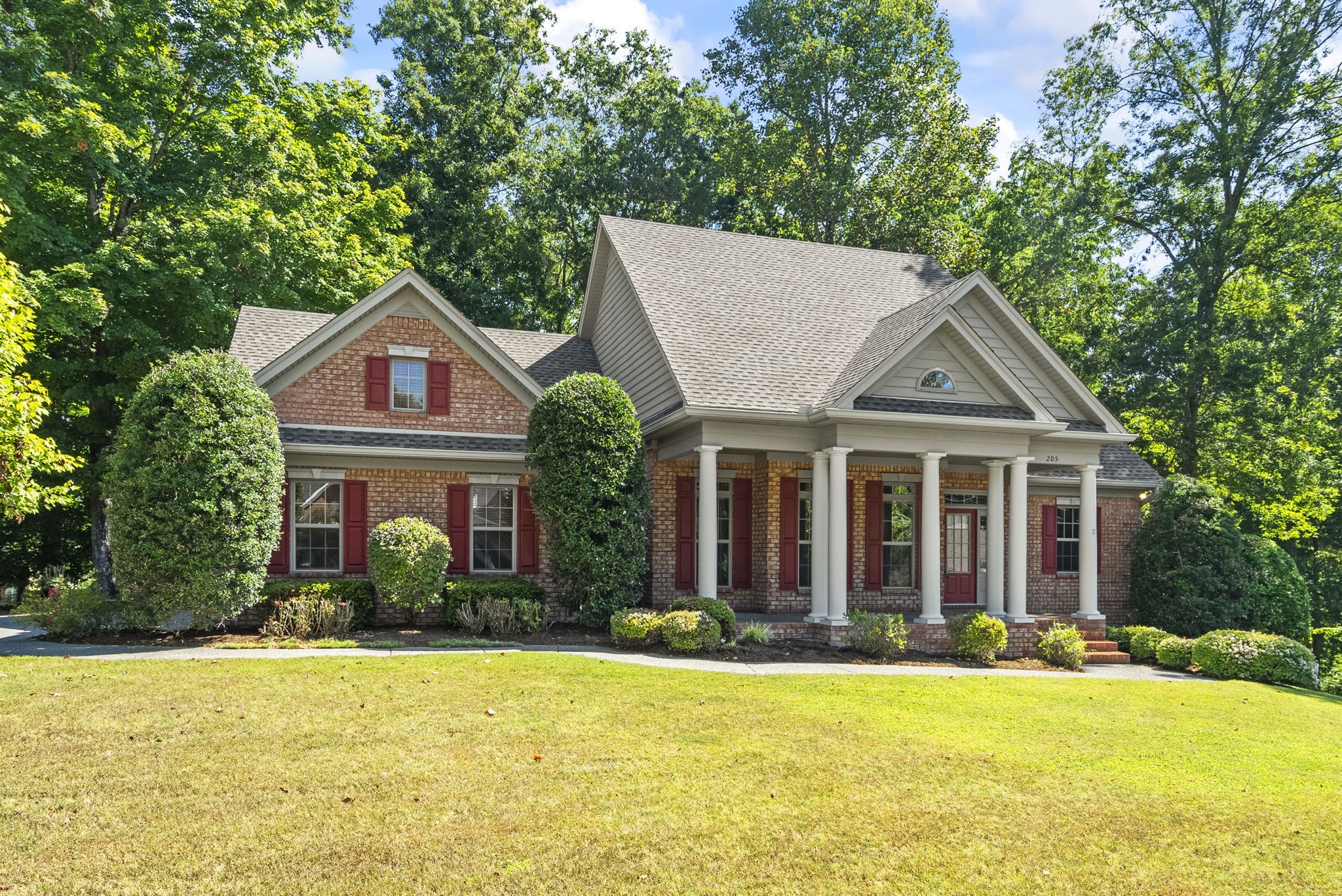 205 Yearling Trace Pleasant View, TN 37146 - Photo 3 of 29 a front view of house with yard and green space
