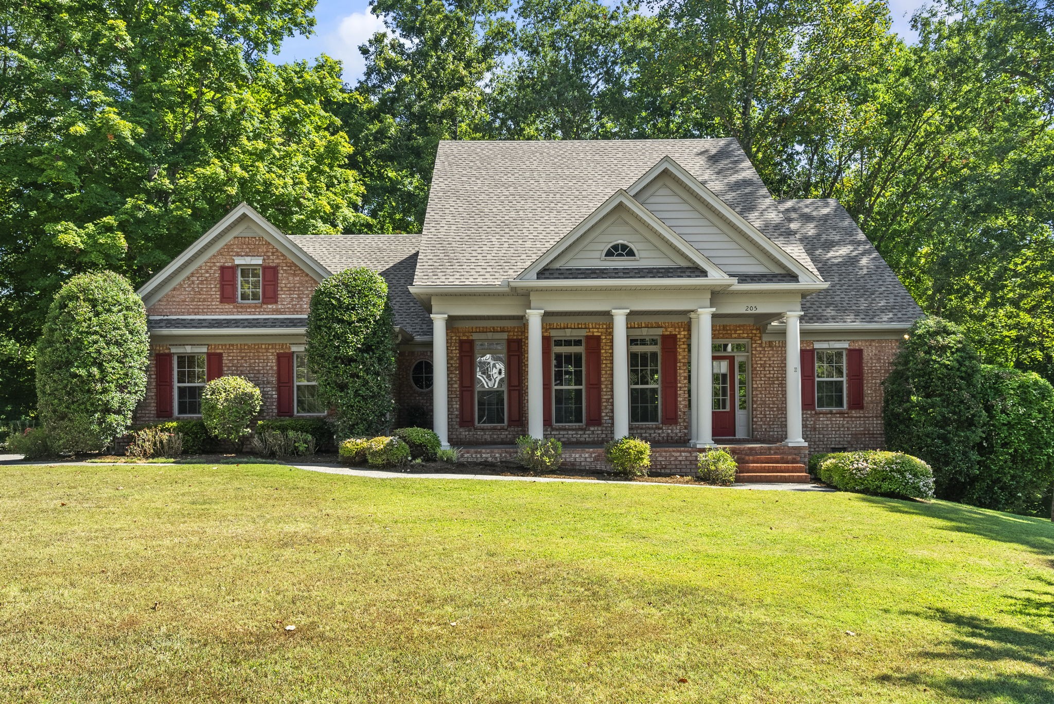 205 Yearling Trace Pleasant View, TN 37146 - Photo 5 of 29 a front view of a house with a yard and trees