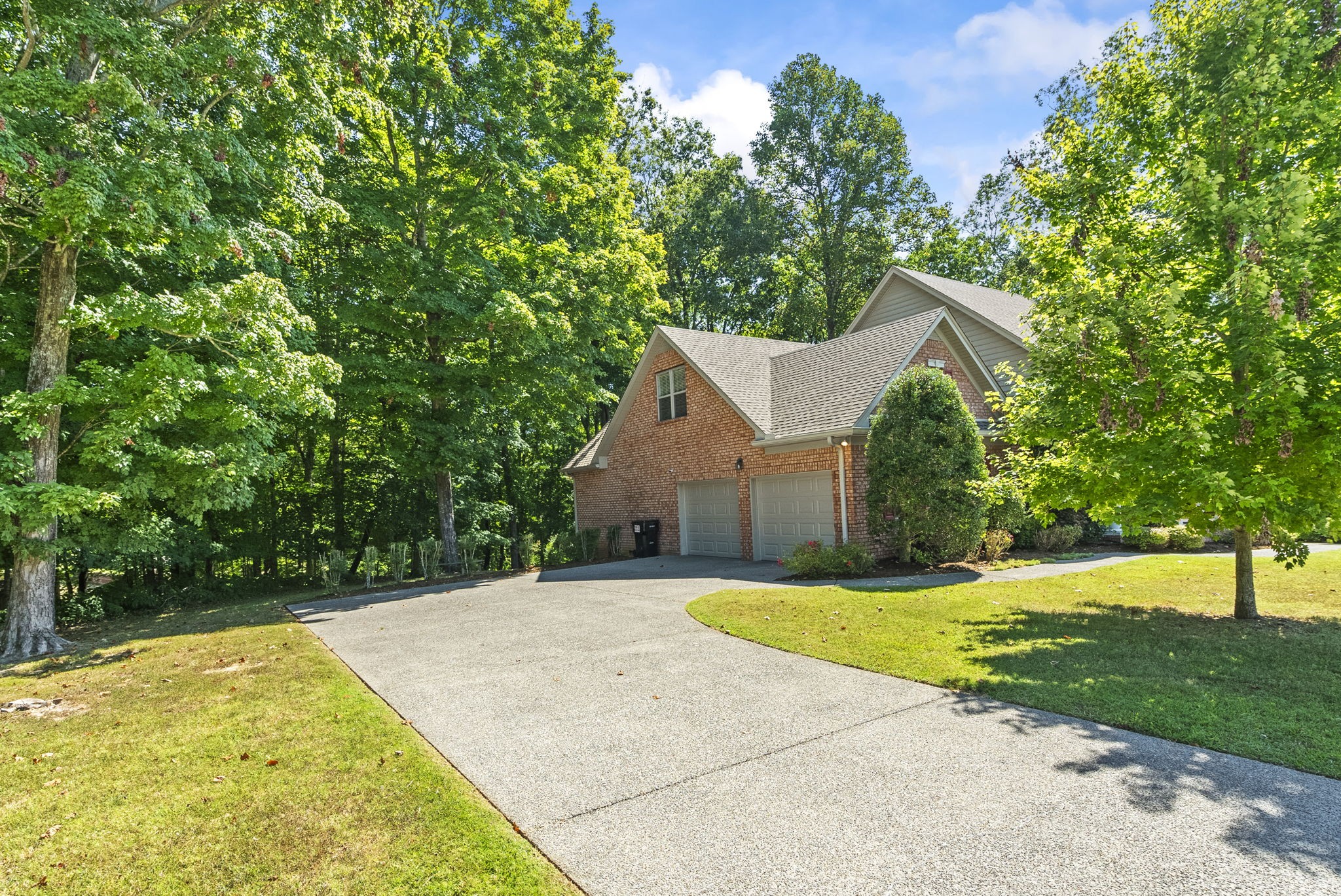 205 Yearling Trace Pleasant View, TN 37146 - Photo 7 of 29 a view of backyard with a garden and entertaining space