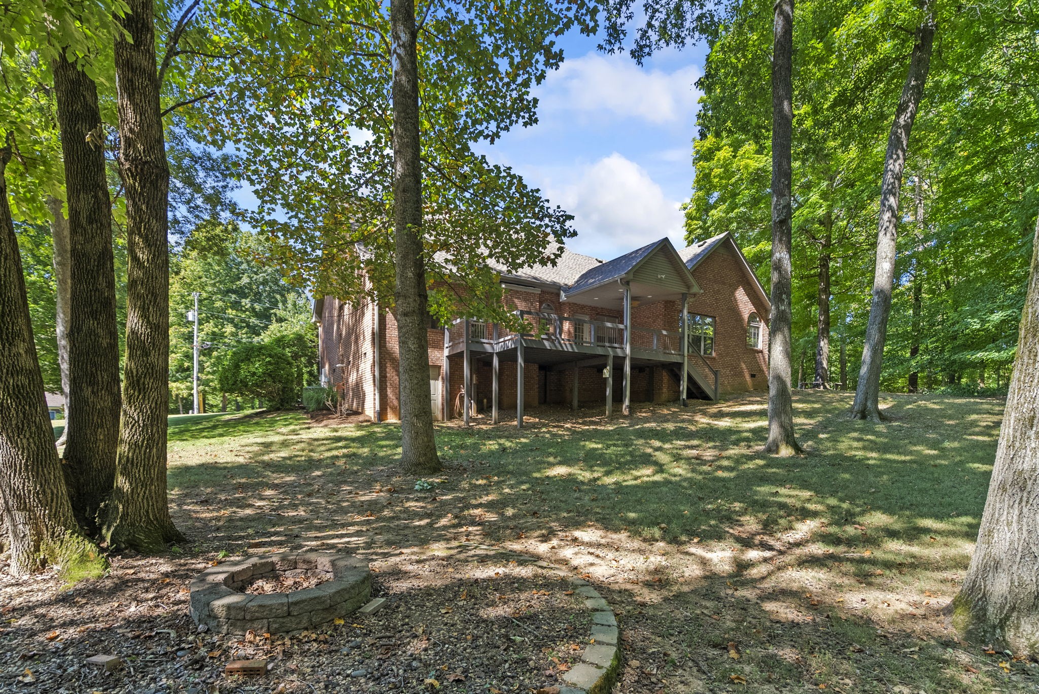 205 Yearling Trace Pleasant View, TN 37146 - Photo 8 of 29 a view of a big house with a big yard and large trees