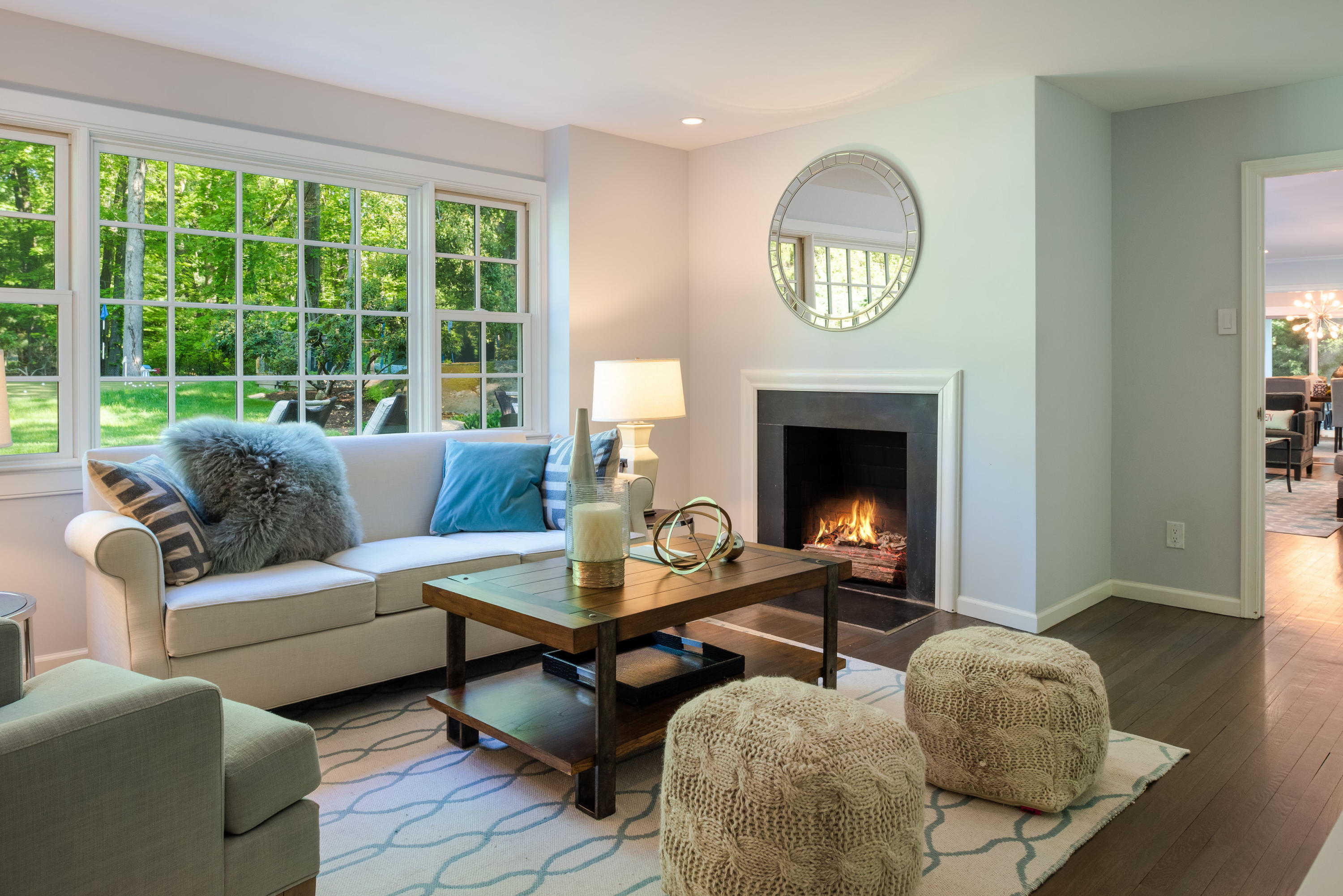 6 Runkenhage Road Darien, CT 06820 - Photo 11 of 32 a living room with furniture a fireplace and a large window