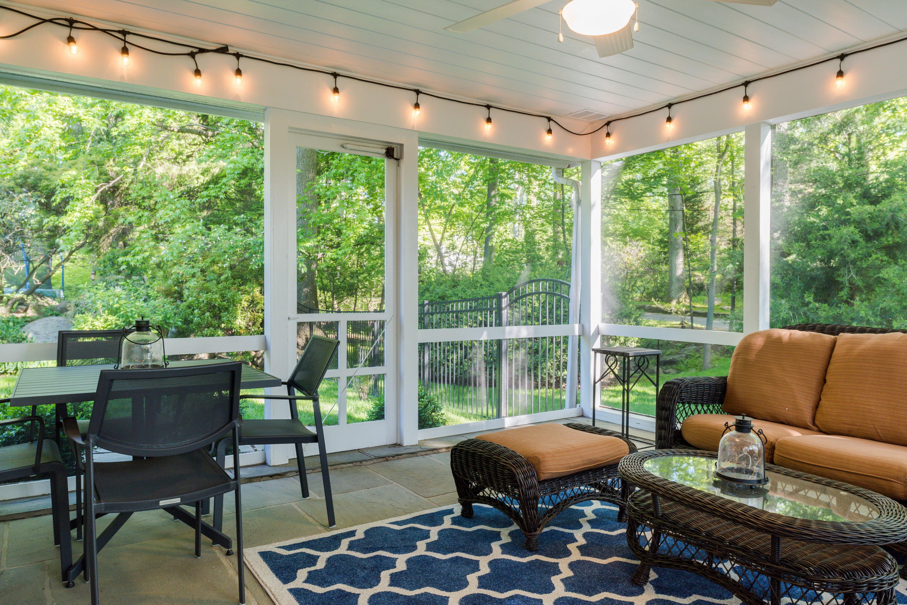 6 Runkenhage Road Darien, CT 06820 - Photo 12 of 32 a outdoor space with patio the couches and a dining table with garden view