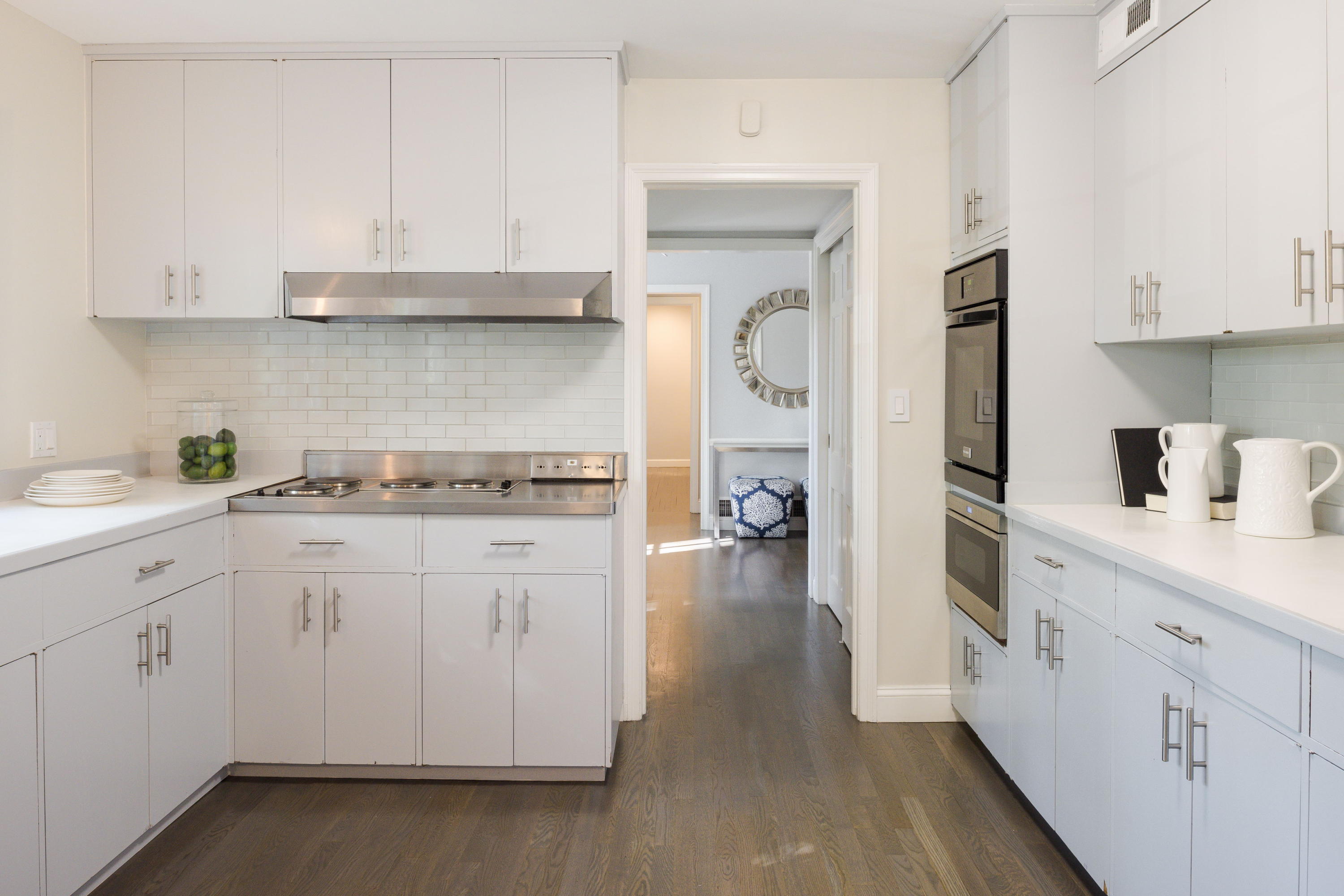 6 Runkenhage Road Darien, CT 06820 - Photo 14 of 32 a kitchen with white cabinets and sink