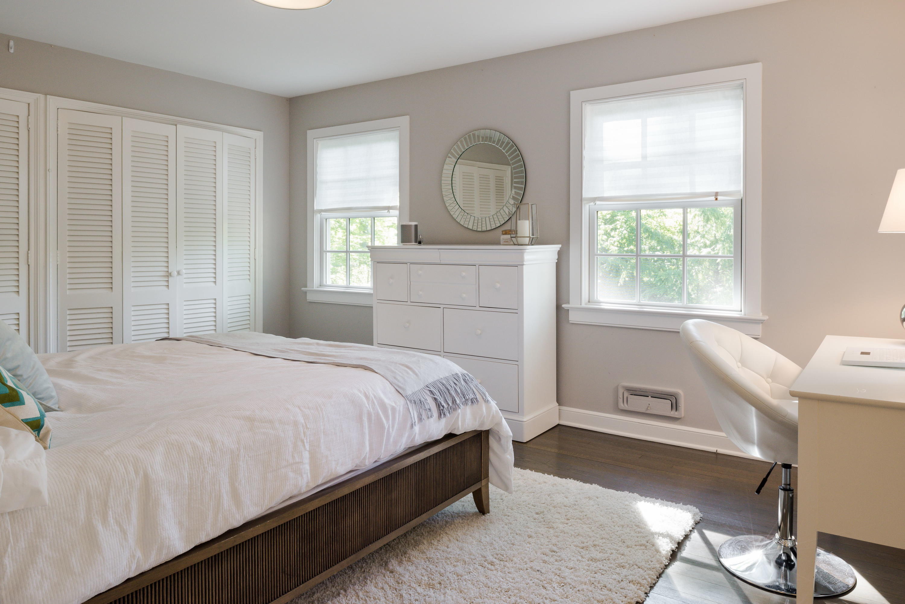 6 Runkenhage Road Darien, CT 06820 - Photo 15 of 32 a bedroom with a bed a mirror and windows