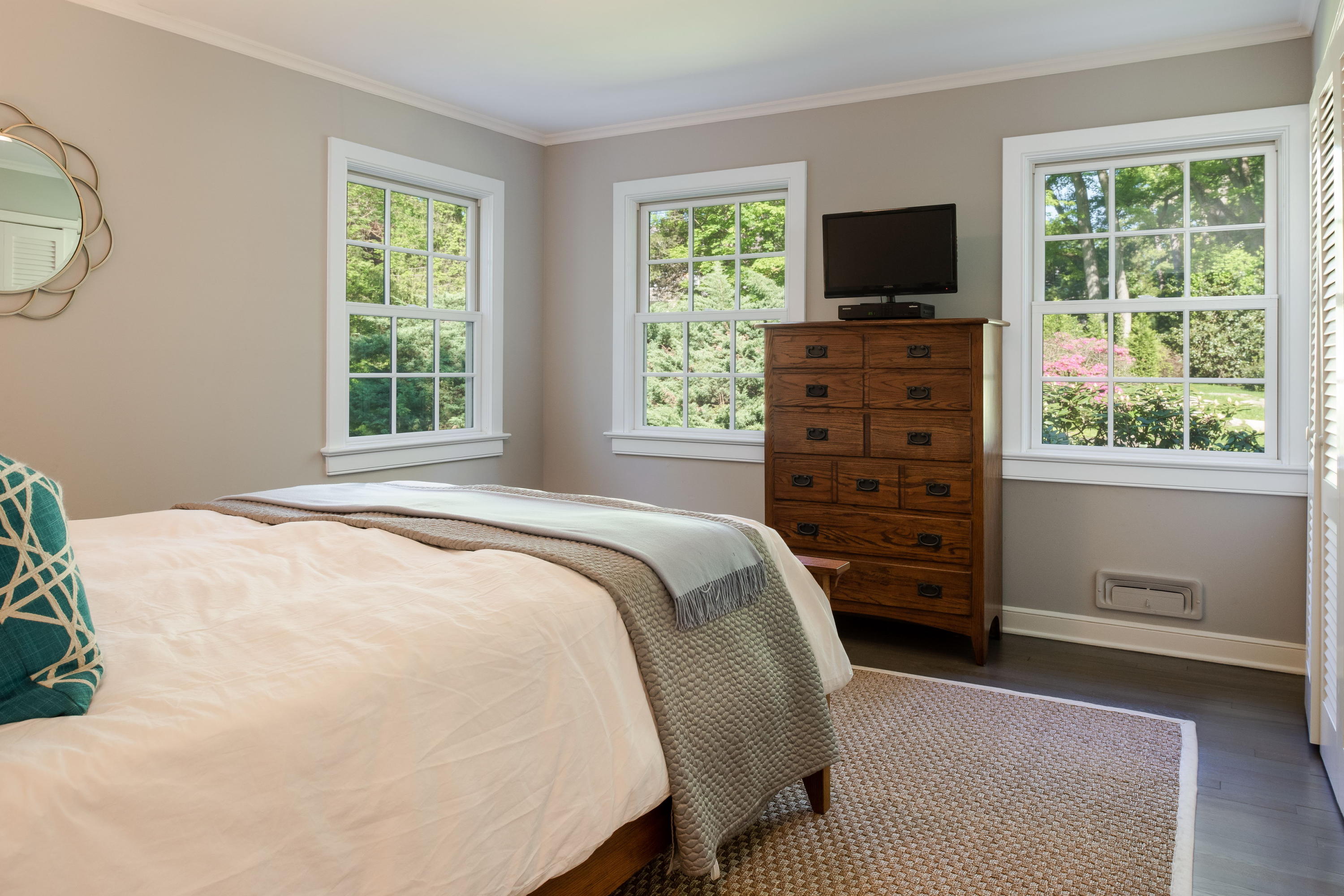 6 Runkenhage Road Darien, CT 06820 - Photo 18 of 32 a spacious bedroom with a bed and a flat screen tv