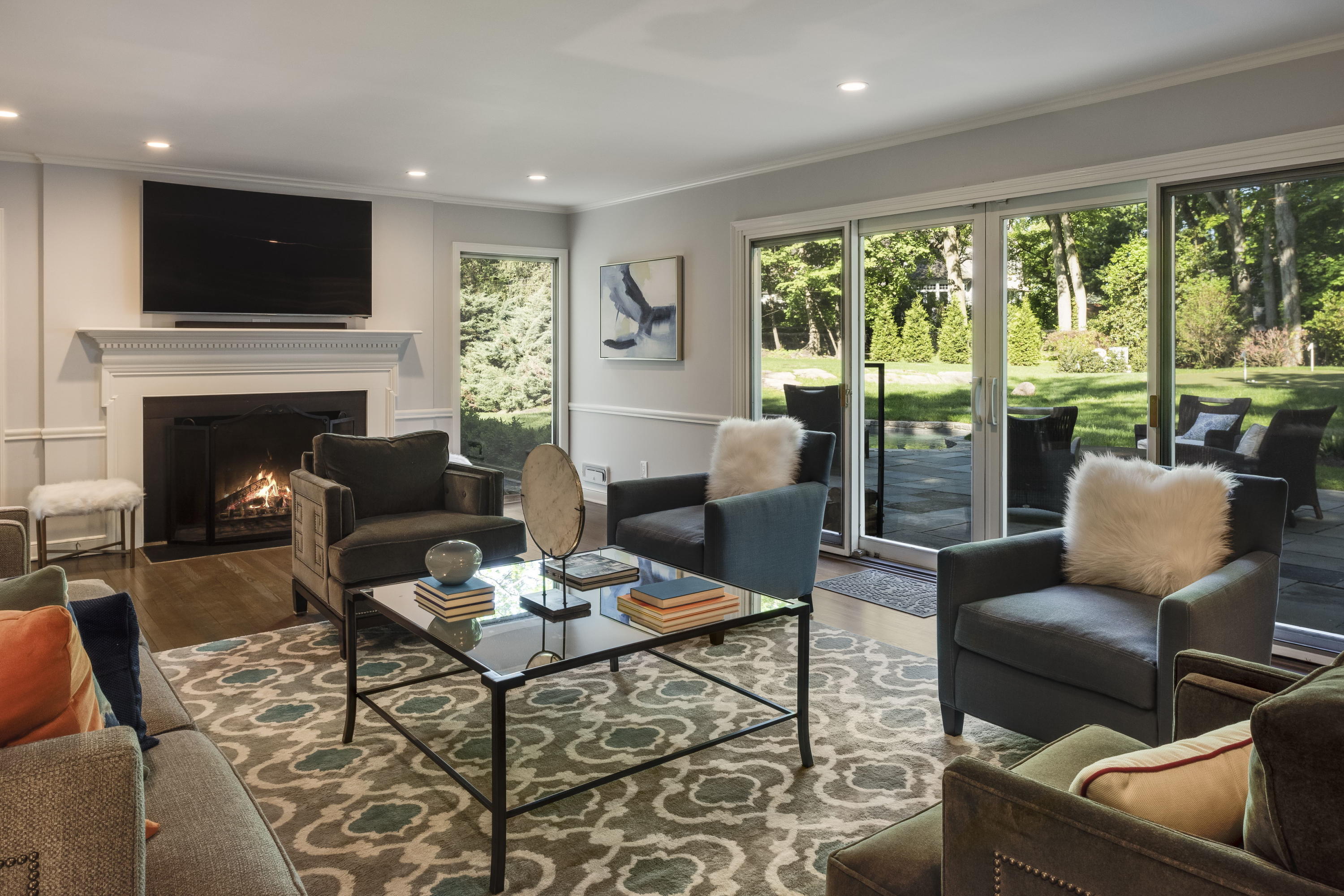 6 Runkenhage Road Darien, CT 06820 - Photo 8 of 32 a living room with furniture fireplace and a large window