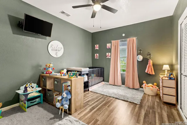 a bathroom with a sink a mirror and a shower curtain