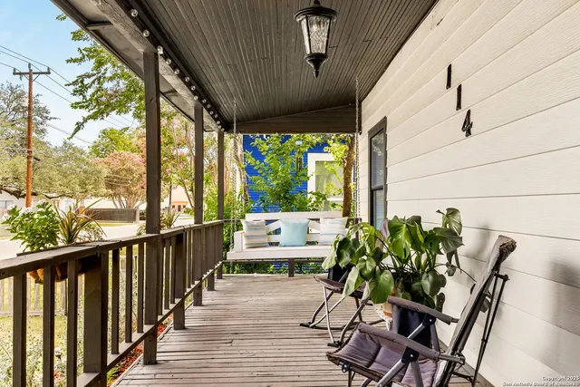 a living room with furniture and painting on the wall