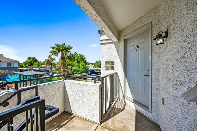 a view of a balcony with furniture