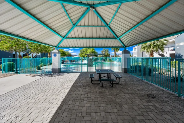 a view of a swimming pool with outdoor seating