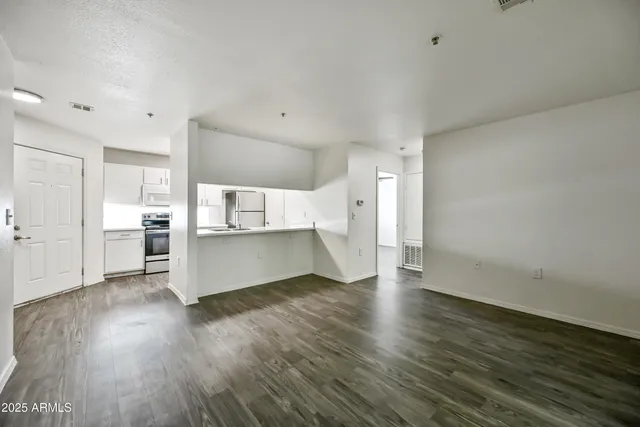 a view of cabinets and wooden floor