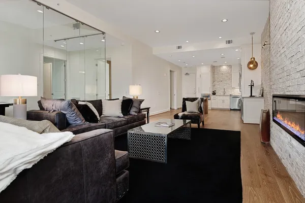 a living room with furniture and a fireplace