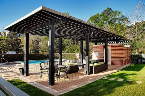 a view of swimming pool with seating space