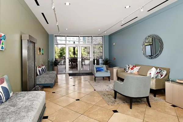 a view of a lobby with furniture and floor to ceiling window